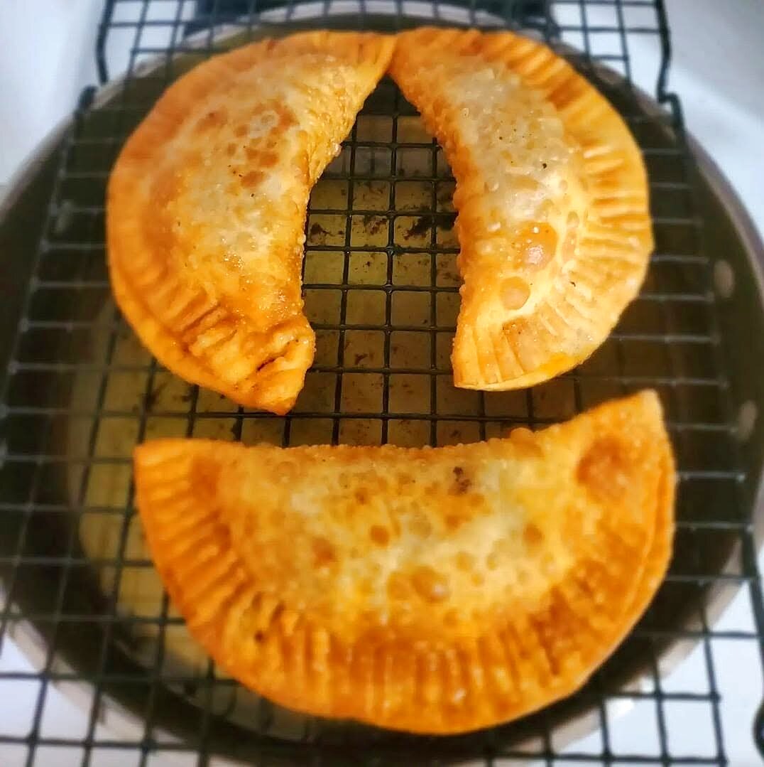 Golden hand-folded empanadas