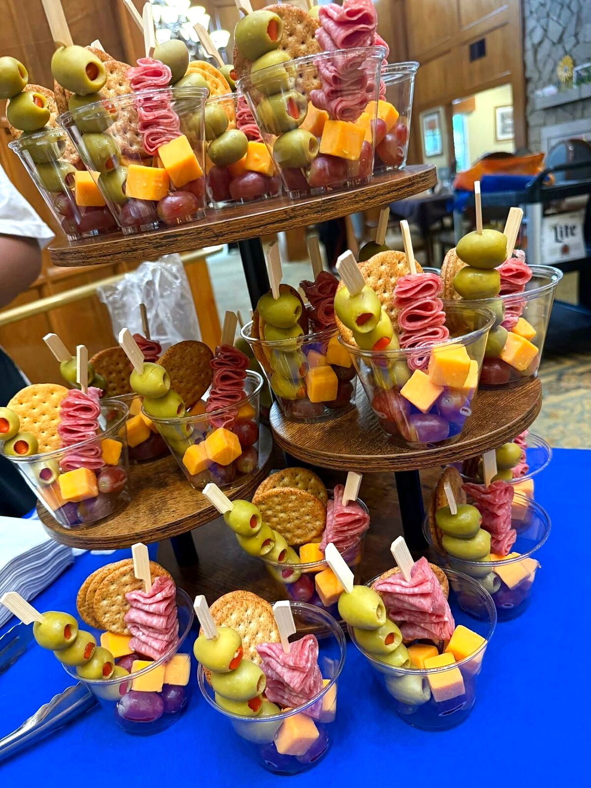 Individual charcuterie cups with olives, salami and cheese